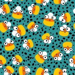 Cartoon Halloween sugar monsters seamless candy corn pattern for wrapping paper and fabrics and linens