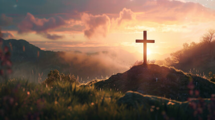 A christian cross on top of a hill during sunset