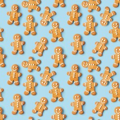 Seamless pattern with cute cartoon gingerbread man Cookies on light blue background.for Christmas gift packing, wrapping, cards, backgrounds. 