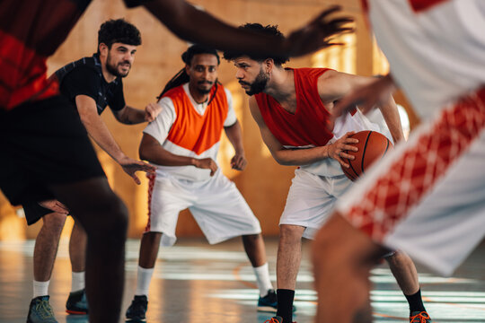 Portrait of a hispanic latino man basketball player guarding the ball