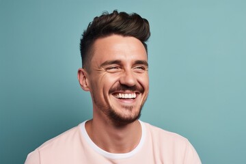 Fototapeta premium A man with a mustache and a pink shirt is smiling