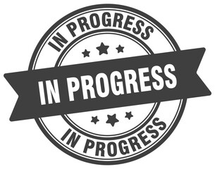 Fototapeta premium in progress stamp. in progress label on transparent background. round sign