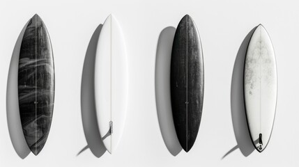 Four surfboards are lined up on a white background