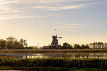 Countryside landscapes of polder in spring, The Molen Leonide along the Hooge Oude Veer river in...