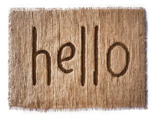 Handmade coir fiber welcome mat with the word hello carved into it isolated on white background
