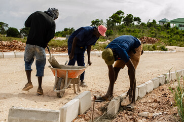 Men laying Curve Wall Blocks