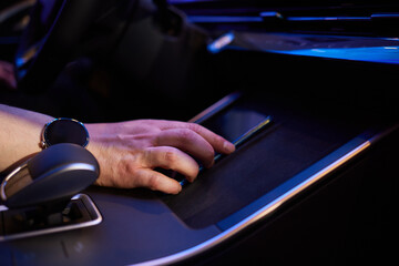 Selector automatic transmission with leather in the interior of a modern expensive car. The background is blurred. Black and brown leather car.