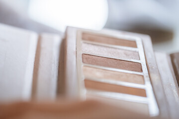 Detail of a makeup palette with earthy brown and golden tones