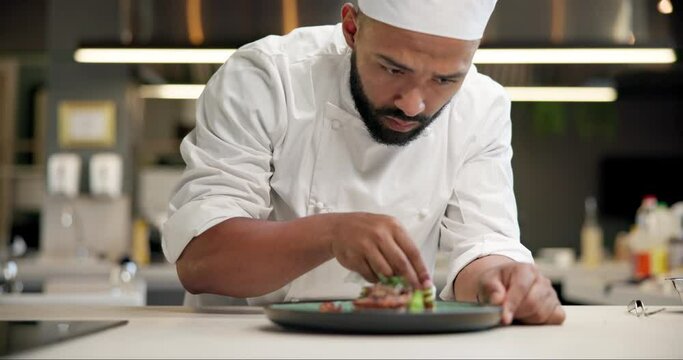 Chef, food and man plating in kitchen cleaning edge for gourmet meal at luxury diner. Hospitality, catering and male culinary worker wipe plate for neat dinner presentation at fine dining restaurant.