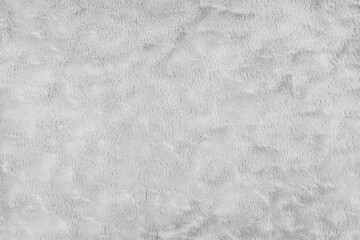 Texture of fluffy white upholstery fabric or cloth. Fabric texture of artificial fur textile...
