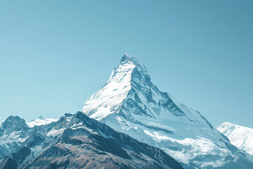 A snow-capped mountain peak against a clear blue sky - Powered by Adobe