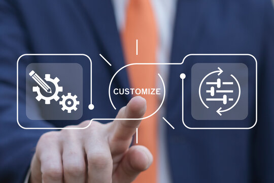Business man using virtual touch screen presses word: CUSTOMIZE. Concept of customize business product. Adjustment, customization and alignment. Personal changes. System regulation. Switch level.