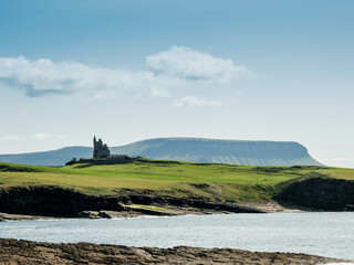 Rough stone coast line and amazing Castle Classiebawn, Mullaghmore area, county Sligo, Ireland....