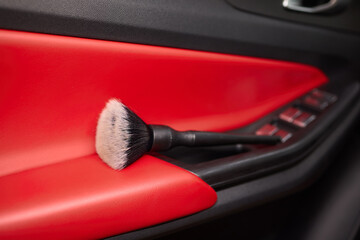 Vehicle dashboard includes a brush