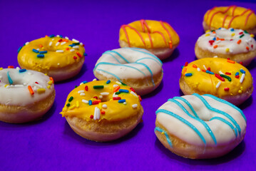 Close Up Of Donuts On A Purple Background