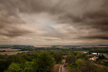 Aerial panorama of the Villany village in Baranya county in Hungary seen from the Villany Mountains at dusk. Villany Mountains, or Hegyseg, is a natural hill chain of southern Hungary.
