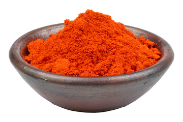 Cayenne pepper powder in a clay bowl isolated transparent