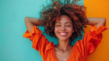 woman with curly hair radiates happiness as she smiles brightly for the camera.