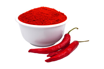 Hot red pepper powder in a white bowl with some fresh red peppers isolated transparet