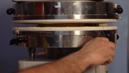 pressing dough making machine in the kitchen, pizza and bakery concept. High quality 4k footage