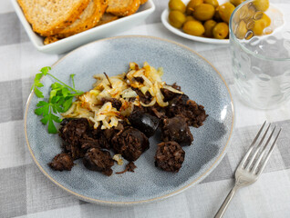 Delicious Catalan blood sausage with rice garnished with baked onions. Popular Spanish tapas..