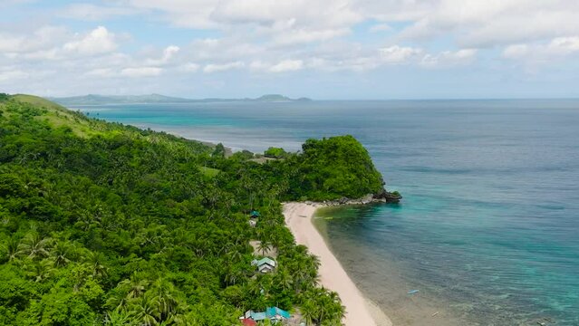 Tropical beach resort with coconut trees and white sand. Santa Fe, Tablas, Romblon. Philippines.