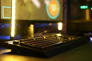 Playing video games. Computer keyboard on table, closeup