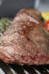 Delicious grilled beef meat in pan, closeup