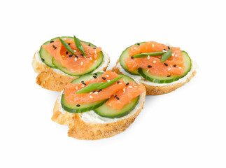 Tasty canapes with salmon, cucumber and cream cheese isolated on white