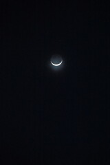 Waxing crescent moon with earthshine 