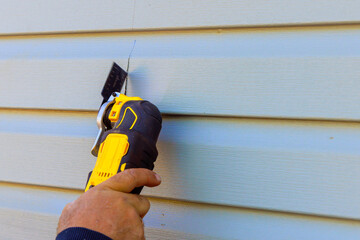 Replacement of exterior plastic siding on wall of house