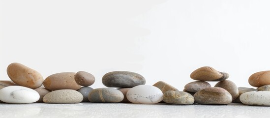 Pebbles for showcasing products on a platform. Image for displaying your products with empty space for text. White background.