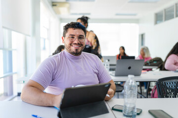 lgbta man in classroom looking at camera