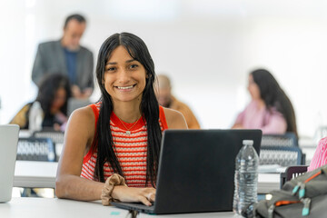 Portrait of a smiling woman at university