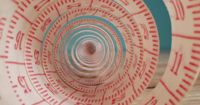 Needle, threads,measuring tape,spools of colored threads are visible in frame. Super macro shot of a measuring tape into a roll of sewing and colored thread on the background stand.Garment factory. 4K