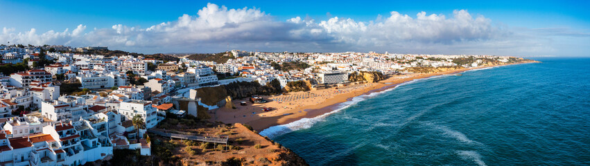 Aerial view of seaside Albufeira with wide beach and white architecture, Algarve, Portugal. Wide...