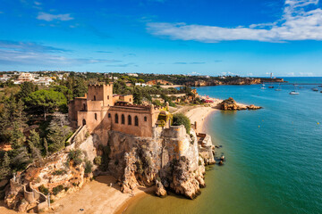 The Fort of Sao Joao do Arade (Castle of Arade) in Ferragudo Village, Algarve. Beach and castle Sao...