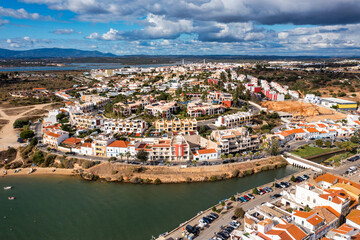 View of Ferragudo village in Algarve, Portugal. Old sea town of Ferragudo. View of Ferragudo from the air. Ferragudo is a beautiful coastal village in Algarve, Portugal, Europe.