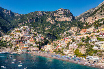 Aerial view of Positano with comfortable beach and blue sea on Amalfi Coast in Campania, Italy....