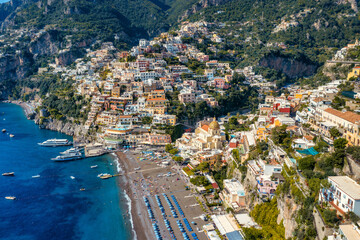 Aerial view of Positano with comfortable beach and blue sea on Amalfi Coast in Campania, Italy. Positano village on the Amalfi Coast, Salerno, Campania. Beautiful Positano, Amalfi Coast in Campania.