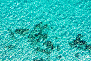 Calm Clear Sea Water Background. Calm Sea Water Background. Aerial footage of a perfectly crystal clear blue turquoise water. Top view of crystal clear blue water surface.