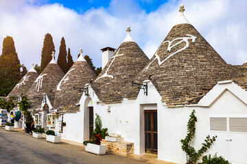 The traditional Trulli houses in Alberobello city, Apulia, Italy. Cityscape over the traditional...