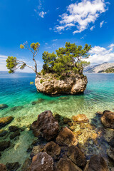 Kamen Brela symbol of the city of Brela on Adriatic coast of Dalmatia, Croatia. Kamen Brela, tiny...