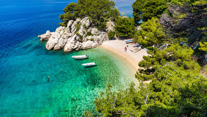 Amazing aerial view of the beautiful Podrace beach in Brela, Makarska Riviera, Croatia. Aerial view of Podrace beach and waterfront on Makarska riviera, Brela, Dalmatia region of Croatia. © daliu