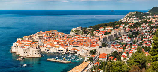 Dubrovnik a city in southern Croatia fronting the Adriatic Sea, Europe. Old city center of famous town Dubrovnik, Croatia. Picturesque view on Dubrovnik old town (medieval Ragusa) and Dalmatian Coast.