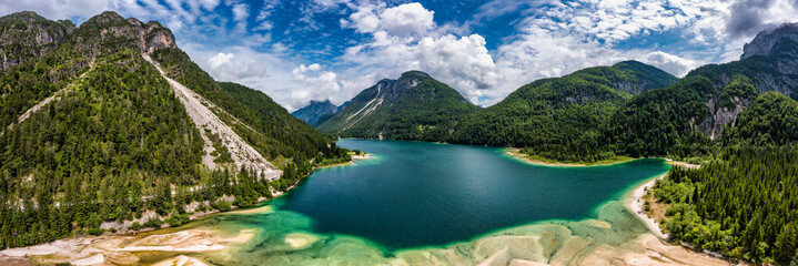 View to Julian Alps mountains above Predil lake in Italy with small lake. Predil Lake, Friuli Italy...