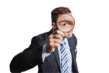 Funny man businessman man with a magnifying glass in his hand