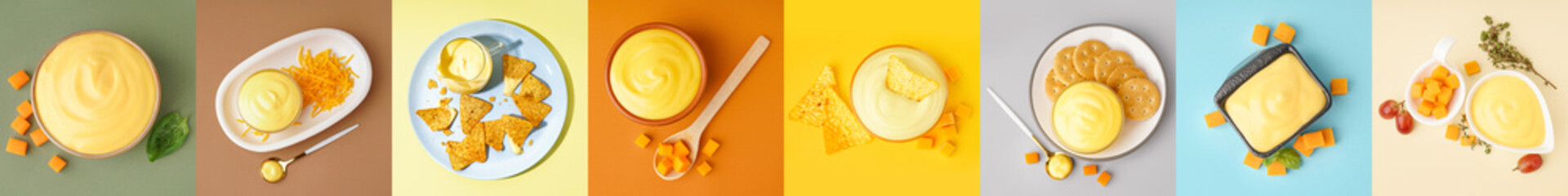 Set of bowls with tasty cheddar cheese sauce and snacks on color background, top view