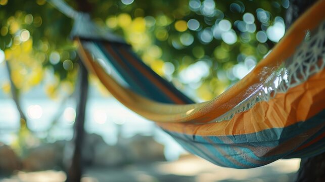 An empty hammock swaying in the breeze as a man takes a nap unplugged from the digital demands of everyday life.