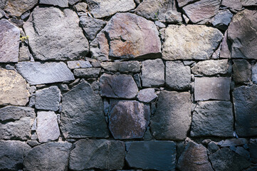 Stone wall texture background - grey stone with different sized stones
